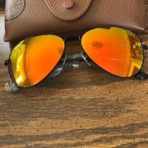 Ray-Ban Aviators with Orange Lenses and a polished Black Frame. Brand New.